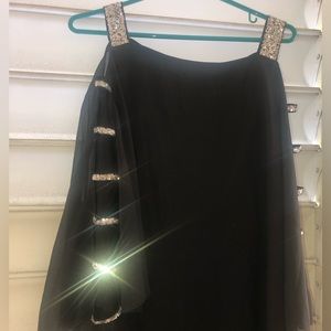 Black dressy rumper. Zipper in back, transparent sleeves simulated rhinestones.